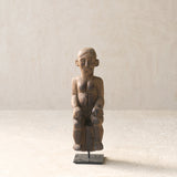 Vintage Naga Tribal Wood Sculpture handcrafted from solid hardwood in Nagaland, India and displayed on a steel stand.