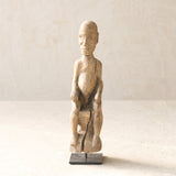 Vintage Naga Tribal Wood Sculpture handcrafted from solid hardwood in Nagaland, India and displayed on a steel stand.
