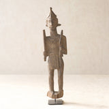 Vintage Naga Tribal Wood Sculpture handcrafted from solid hardwood in Nagaland, India and displayed on a steel stand.