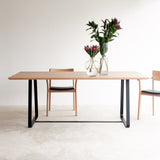 Oak dining table with black sleigh base | Originals Furniture Singapore