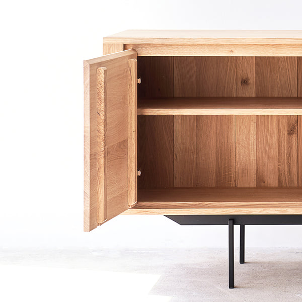 Ethnicraft shadow oak sideboard 1 door 3 drawers crafted from high quality European oak with adjustable shelves and soft closing blum - $2590