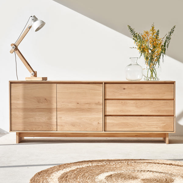 Ethnicraft wave oak sideboard 2 doors 3 drawers crafted from high quality European oak with removable shelves and soft closing blum drawer runners - $3860