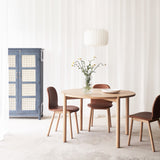 Cove Oak Round Dining Table with Puddle Dining Chair