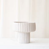 Maja Pot, cream cement/stone accessory. A modern yet subtle, neutral look in your home. Add a touch of personality to the interior with its texture. Available in different sizes from $160.