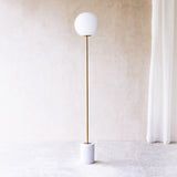 Medina Floor Lamp, marble base and glass shade. Bold and timeless statement piece. It is a functional piece that provides a touch of luxury in any home. Available at $680.