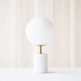 Medina Table Lamp, marble base and glass shade. Bold and timeless statement piece. It is a functional piece that provides a touch of luxury in any home. Available at $380.