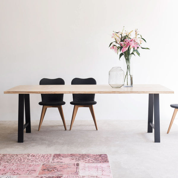 Java teak dining table in whitewash with black A-frame base and lily dining chairs in black - Originals Furniture Singapore