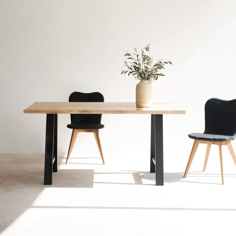 Java teak dining table in whitewash with black A-frame base and lily dining chairs in black - Originals Furniture Singapore