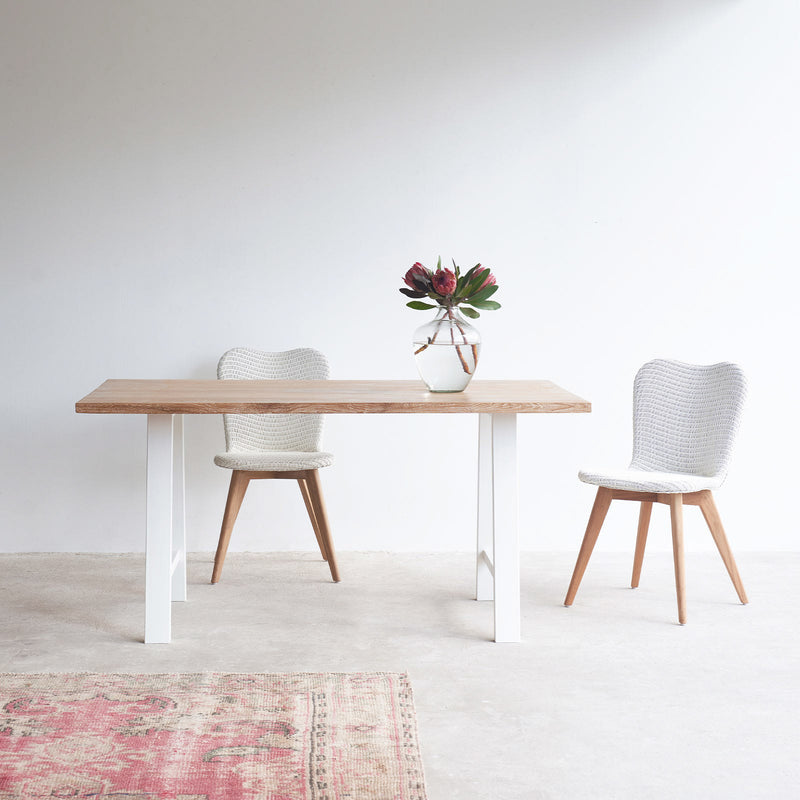 Java teak dining table in whitewash with white A-frame base and lily dining chairs in white - Originals Furniture Singapore