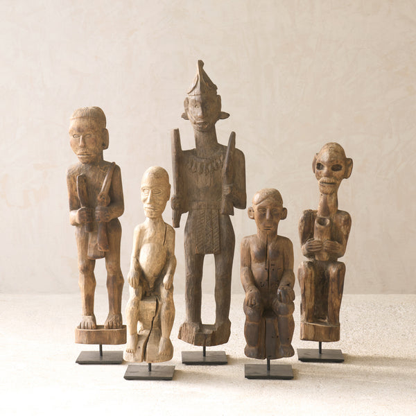 Vintage Naga Tribal Wood Sculpture handcrafted from solid hardwood in Nagaland, India and displayed on a steel stand.