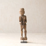 Vintage Naga Tribal Wood Sculpture handcrafted from solid hardwood in Nagaland, India and displayed on a steel stand.