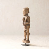 Vintage Naga Tribal Wood Sculpture handcrafted from solid hardwood in Nagaland, India and displayed on a steel stand.