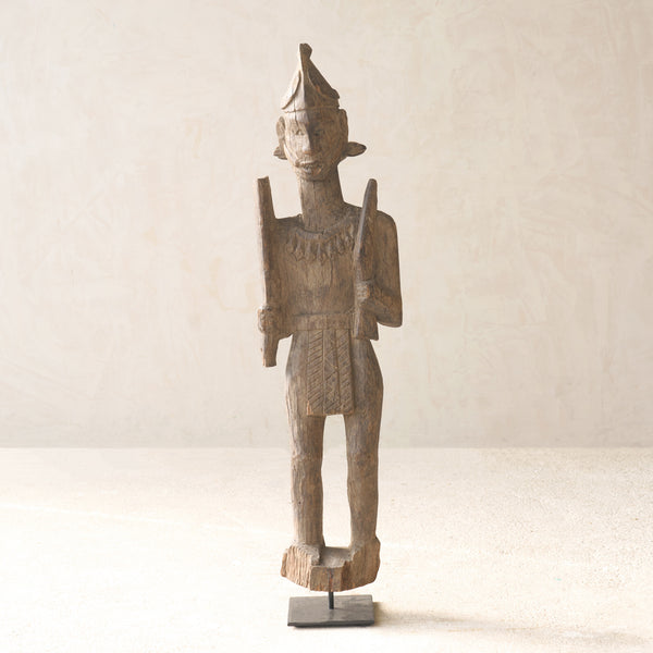 Vintage Naga Tribal Wood Sculpture handcrafted from solid hardwood in Nagaland, India and displayed on a steel stand.