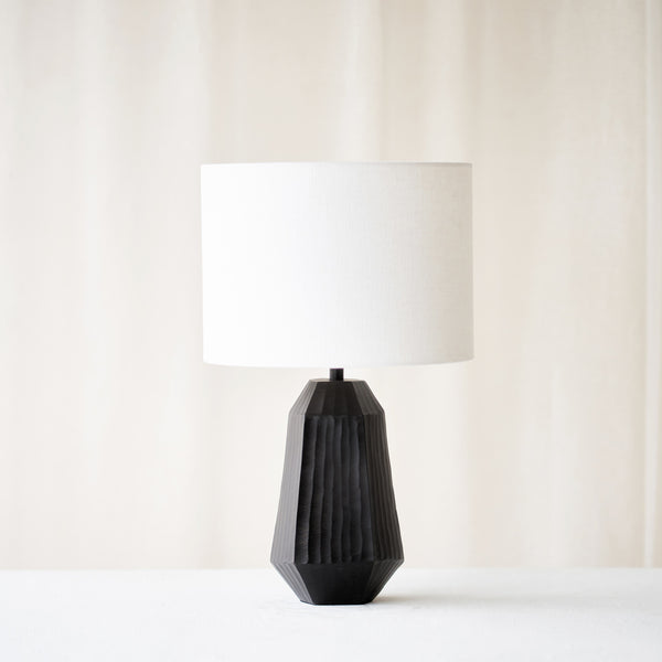 Mirissa Table Lamp, black and geometric shaped. Sophisticated and stylish piece. It is a versatile piece that provides a touch of luxury and a contemporary feel in any home. Available at $380.
