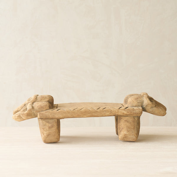 Vintage Naga Tribal Stool Natural handcrafted from solid hardwood in Nagaland, India, featuring a sculptural hand-carved design and natural restored finish.