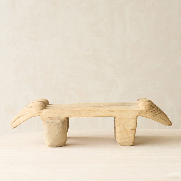 Vintage Naga Tribal Stool Natural handcrafted from solid hardwood in Nagaland, India, featuring a sculptural hand-carved design and natural restored finish.