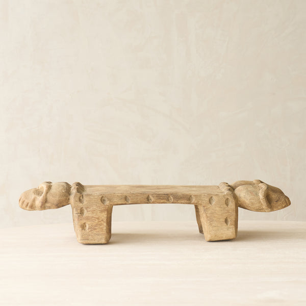 Vintage Naga Tribal Stool Natural handcrafted from solid hardwood in Nagaland, India, featuring a sculptural hand-carved design and natural restored finish.