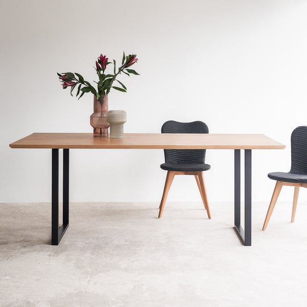 Oak dining table with black U base - Originals Furniture Singapore