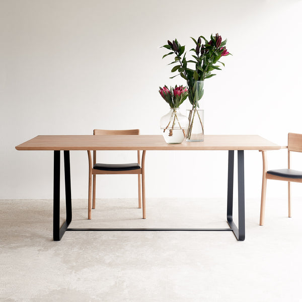 Oak dining table with black sleigh base | Originals Furniture Singapore