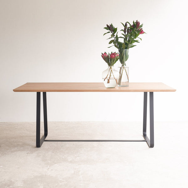 Oak dining table with black sleigh base | Originals Furniture Singapore
