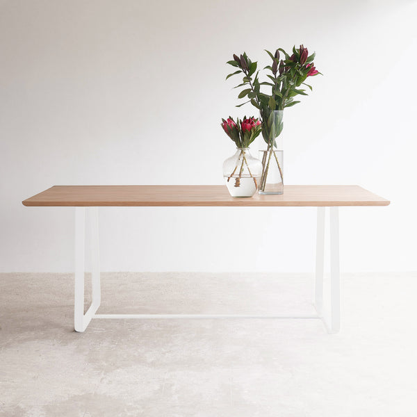 Oak dining table with white sleigh base | Originals Furniture Singapore