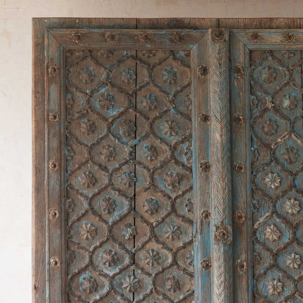 Blue Door with Carved Flower Motifs