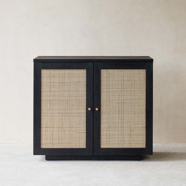 Hudson Black Teak Rattan Sideboard, 2 Doors, Square Webbing. Rattan details and metal handles with generous storage. Versatile and timeless piece. Available at $1,980.