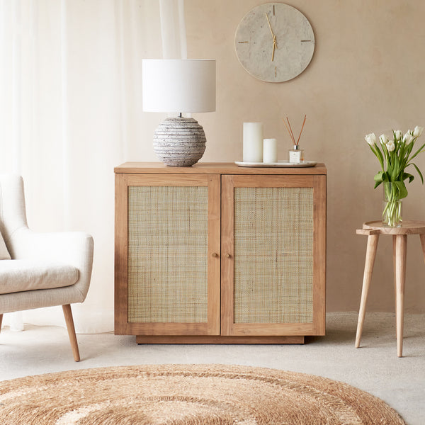 Hudson Natural Teak Rattan Sideboard, 2 Doors, Square Webbing. Rattan details and metal handles with generous storage. Versatile and timeless piece. Available at $1,980.