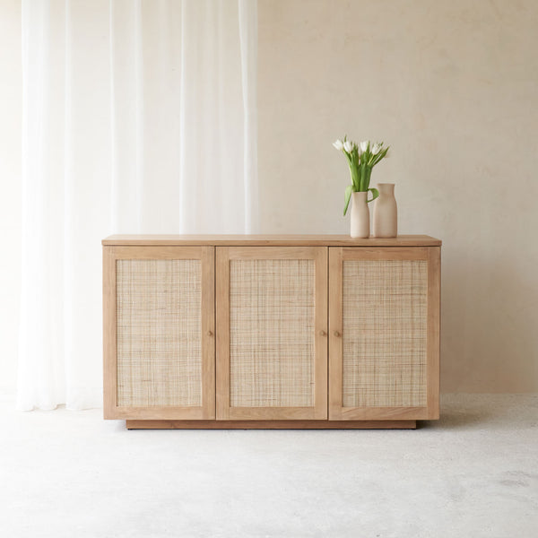 Hudson Natural Teak Rattan Sideboard, 3 Doors, Square Webbing. Rattan details and metal handles with generous storage. Versatile and timeless piece. Available at $3280.