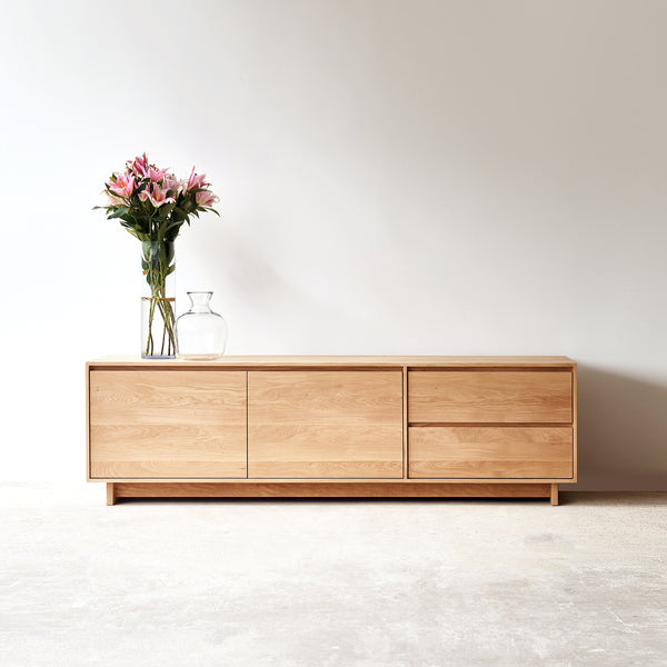 Ethnicraft wave oak TV console 2 doors 2 drawers, crafted from high quality European oak with soft closing blum drawer runners - $3260