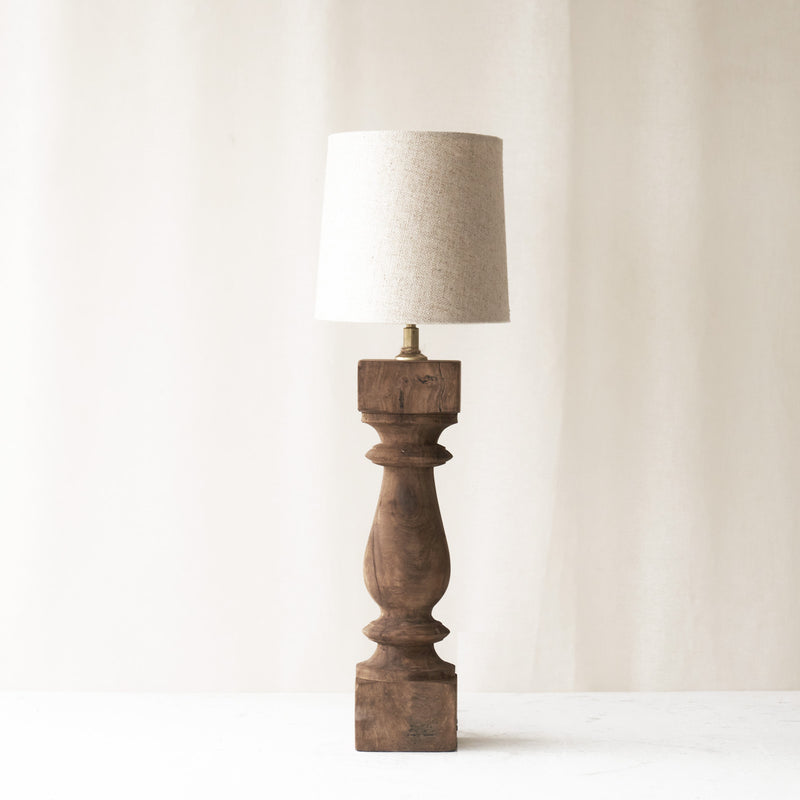 Cumani Table Lamp, wooden and sophisticated. Ornate design and stylish piece. Versatile piece that provides a classy touch in any home. Available in different sizes from $180.