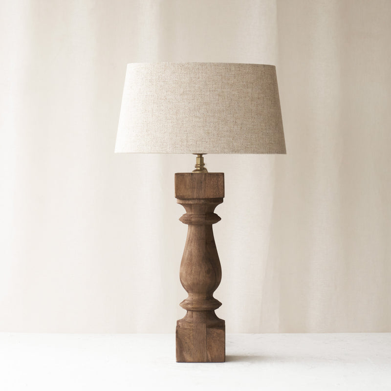 Cumani Table Lamp, wooden and sophisticated. Ornate design and stylish piece. Versatile piece that provides a classy touch in any home. Available in different sizes from $180.