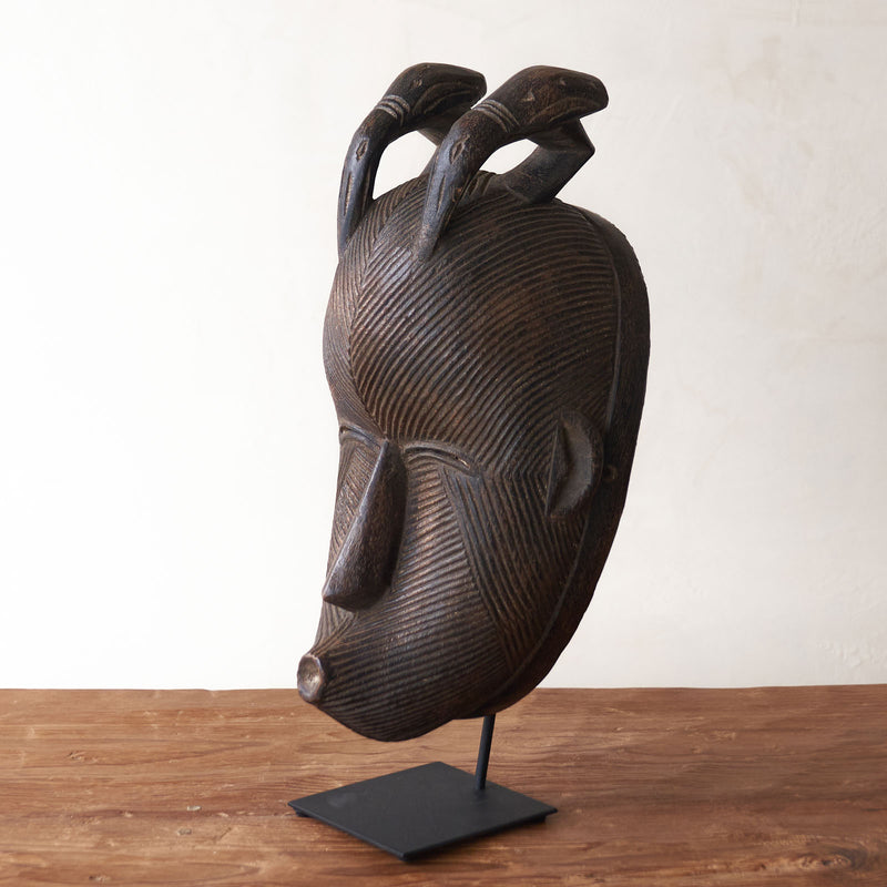 Songye Mask, hand-carved from local wood. Each is an original unique piece. these authentic African masks make for a stunning visual in any space. From $240