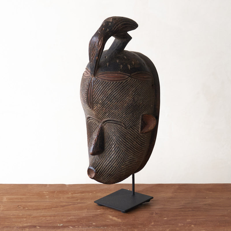 Songye Mask, hand-carved from local wood. Each is an original unique piece. these authentic African masks make for a stunning visual in any space. From $240