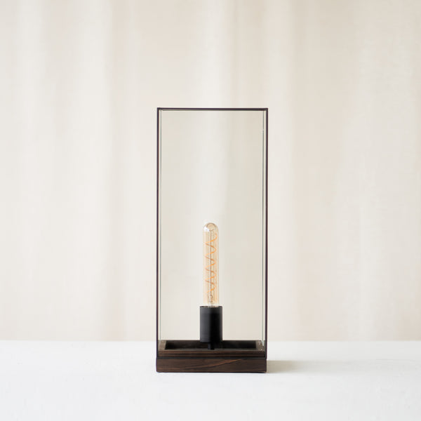 Askjer Table Lamp, black and delicately shaped. Sleek and stylish piece. It is a versatile piece that provides a touch of luxury in any home. Available at $280.