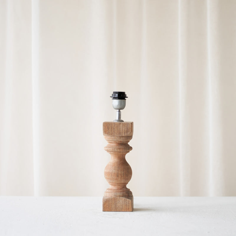 Cumani Table Lamp, wooden and sophisticated. Ornate design and stylish piece. Versatile piece that provides a classy touch in any home. Available in different sizes from $180.