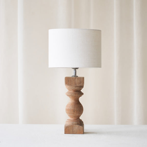Cumani Table Lamp, wooden and sophisticated. Ornate design and stylish piece. Versatile piece that provides a classy touch in any home. Available in different sizes from $180.