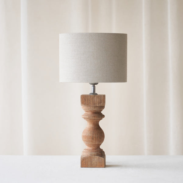 Cumani Table Lamp, wooden and sophisticated. Ornate design and stylish piece. Versatile piece that provides a classy touch in any home. Available in different sizes from $180.