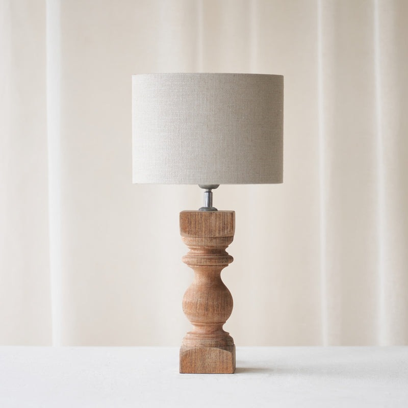 Cumani Table Lamp, wooden and sophisticated. Ornate design and stylish piece. Versatile piece that provides a classy touch in any home. Available in different sizes from $180.