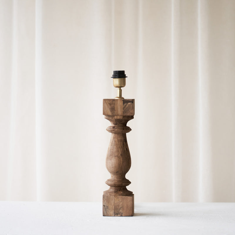 Cumani Table Lamp, wooden and sophisticated. Ornate design and stylish piece. Versatile piece that provides a classy touch in any home. Available in different sizes from $180.