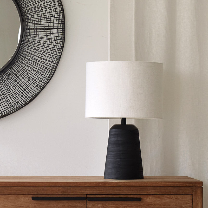 Lilou Table Lamp, black and sleek shaped. Sophisticated and stylish piece. It is a versatile piece that provides a touch of luxury and texture in any home. Available at $280.