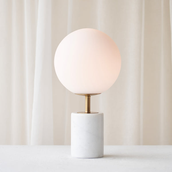 Medina Table Lamp, marble base and glass shade. Bold and timeless statement piece. It is a functional piece that provides a touch of luxury in any home. Available at $380.