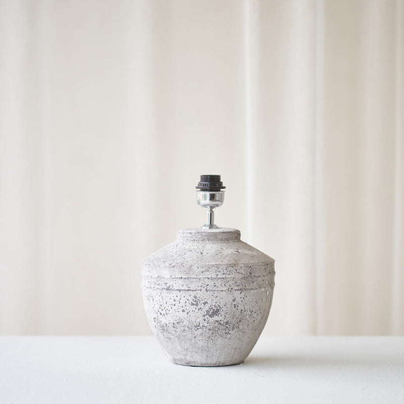 Toba Table Lamp, textured finish. Unique and versatile piece that provides a touch of drama in any home. Available at $360.