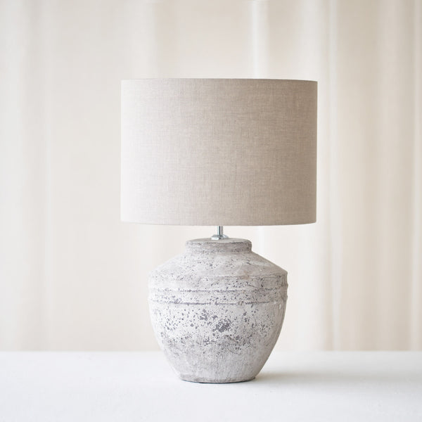 Toba Table Lamp, textured finish. Unique and versatile piece that provides a touch of drama in any home. Available at $360.