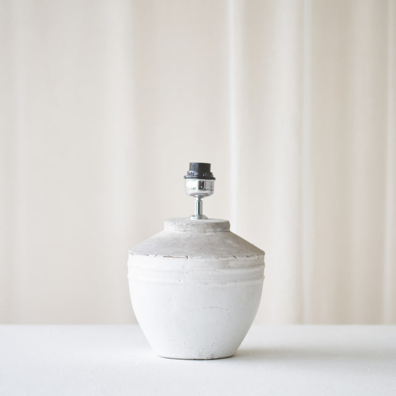 Toba Table Lamp, textured finish. Unique and versatile piece that provides a touch of drama in any home. Available at $360.